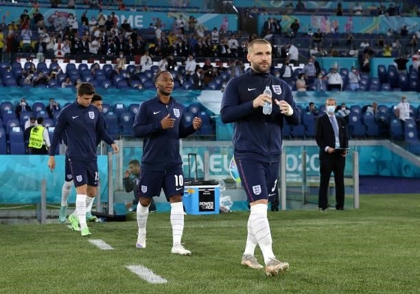 Luke Shaw and Raheem Sterling of England walk out with teammates prior to the UEFA Euro 2020 Championship Quarter-final match between Ukraine and...