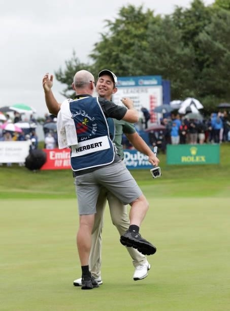 Lucas Herbert from Australia celebrates victory with his caddy Nick Pugh after the final round of The Dubai Duty Free Irish Open at Mount Juliet Golf...