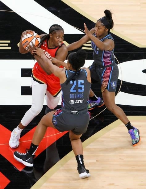 Chelsea Gray of the Las Vegas Aces is guarded by Monique Billings and Aari McDonald of the Atlanta Dream during their game at Michelob ULTRA Arena on...