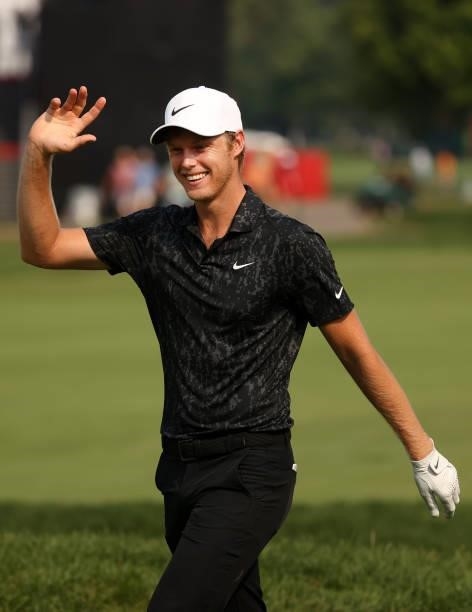 Cam Davis of Australia reacts after making an eagle on the 17th hole during the final round of the Rocket Mortgage Classic on July 04, 2021 at the...
