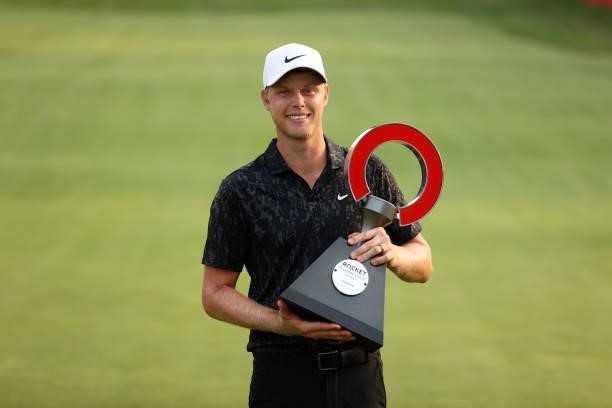 Cam Davis of Australia poses with the trophy after winning on the fifth sudden death playoff hole against Troy Merritt during the final round of the...