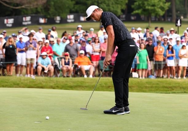 Cam Davis of Australia reacts to a putt to get him into the playoff on the 18th green during the final round of the Rocket Mortgage Classic on July...