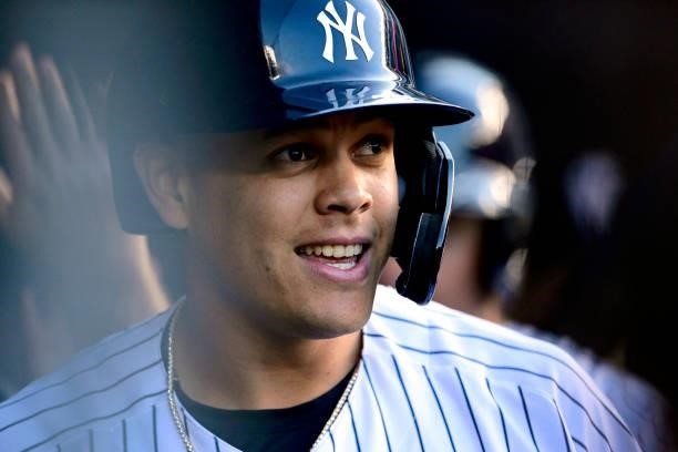 Gio Urshela of the New York Yankees reacts in the dugout after hitting a three-run home run against the New York Mets in the second inning during...