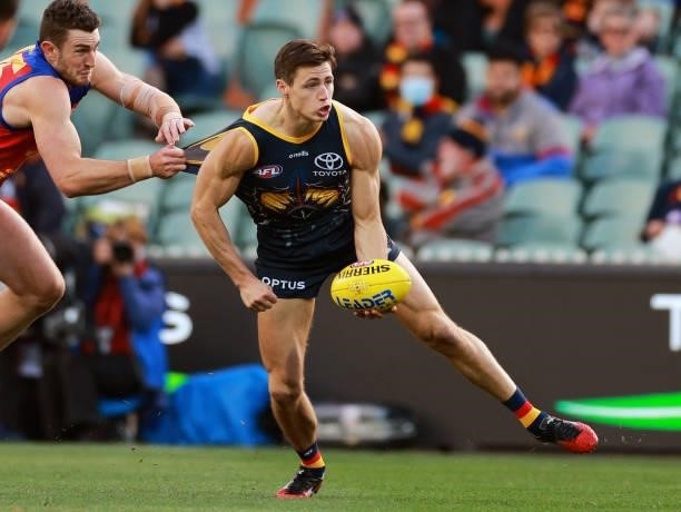 Jake Kelly of the Crows handballs during the round 16 AFL match between Adelaide Crows and Brisbane Lions at Adelaide Oval on July 03, 2021 in...