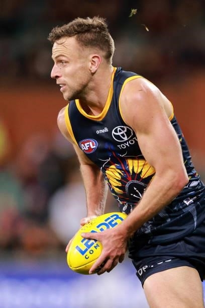 Brodie Smith of the Crows runs with the ball during the round 16 AFL match between Adelaide Crows and Brisbane Lions at Adelaide Oval on July 03,...