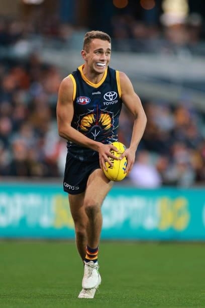Lachlan Sholl of the Crows runs with the ball during the round 16 AFL match between Adelaide Crows and Brisbane Lions at Adelaide Oval on July 03,...