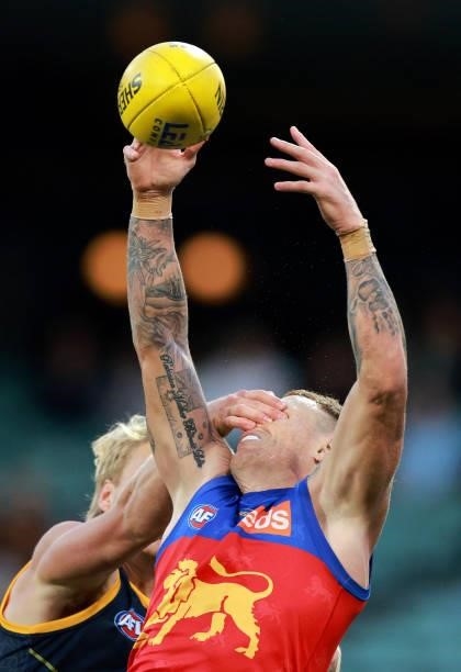 Billy Frampton of the Crows and Mitch Robinson of the Lions compete for the ball during the round 16 AFL match between Adelaide Crows and Brisbane...