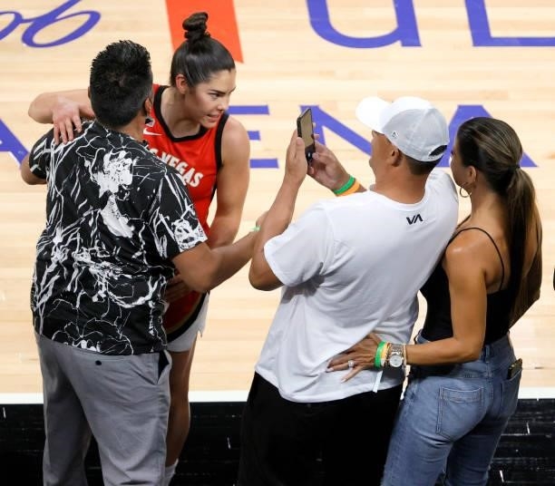 Kelsey Plum of the Las Vegas Aces greets friends courtside after the team's 118-95 victory over the Atlanta Dream at Michelob ULTRA Arena on July 4,...