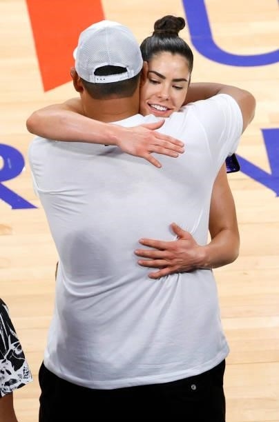 Kelsey Plum of the Las Vegas Aces hugs a friend courtside after the team's 118-95 victory over the Atlanta Dream at Michelob ULTRA Arena on July 4,...