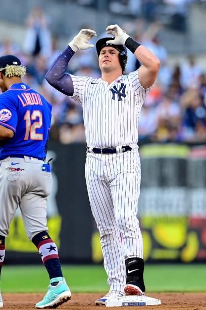 Luke Voit of the New York Yankees celebrates after hitting a double against the New York Mets in the second inning of game two of a doubleheader at...