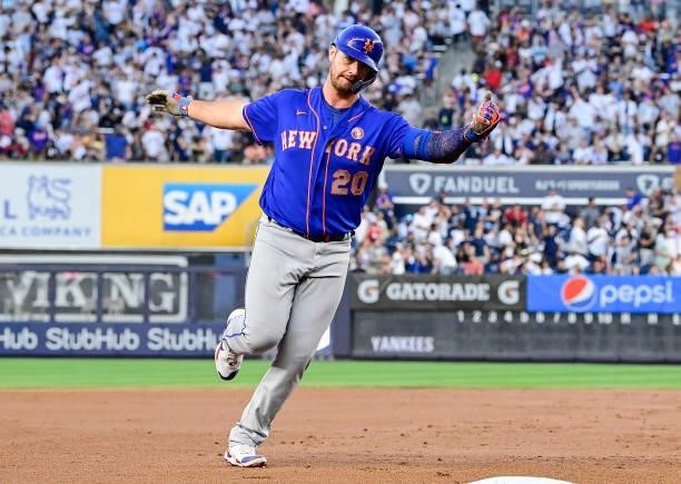 Pete Alonso of the New York Mets celebrates his two-run home run as he rounds third base against the New York Yankees in the fourth inning during...