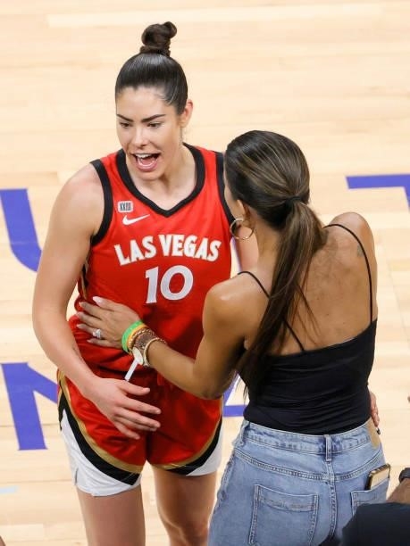 Kelsey Plum of the Las Vegas Aces greets a friend courtside after the team's 118-95 victory over the Atlanta Dream at Michelob ULTRA Arena on July 4,...