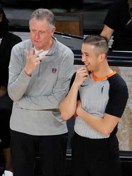 Interim head coach Mike Petersen of the Atlanta Dream talks with referee Isaac Barnett during a game against the Las Vegas Aces at Michelob ULTRA...