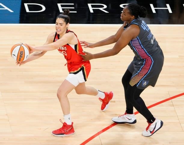 Kelsey Plum of the Las Vegas Aces passes under pressure from Shekinna Stricklen of the Atlanta Dream during their game at Michelob ULTRA Arena on...