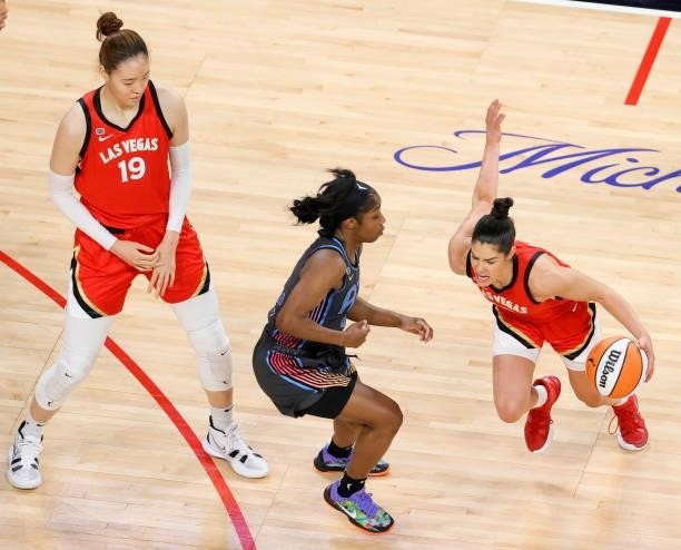 JiSu Park of the Las Vegas Aces sets a screen for teammate Kelsey Plum as she drives against Aari McDonald of the Atlanta Dream during their game at...