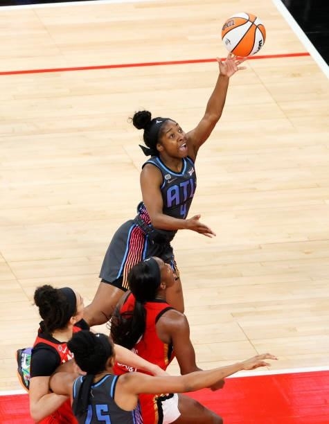 Aari McDonald of the Atlanta Dream is fouled by Jackie Young of the Las Vegas Aces during their game at Michelob ULTRA Arena on July 4, 2021 in Las...
