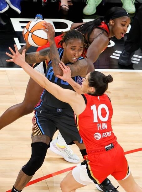 Crystal Bradford of the Atlanta Dream is guarded by Jackie Young and Kelsey Plum of the Las Vegas Aces during their game at Michelob ULTRA Arena on...