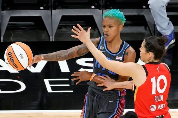 Courtney Williams of the Atlanta Dream passes against Kelsey Plum of the Las Vegas Aces during their game at Michelob ULTRA Arena on July 4, 2021 in...