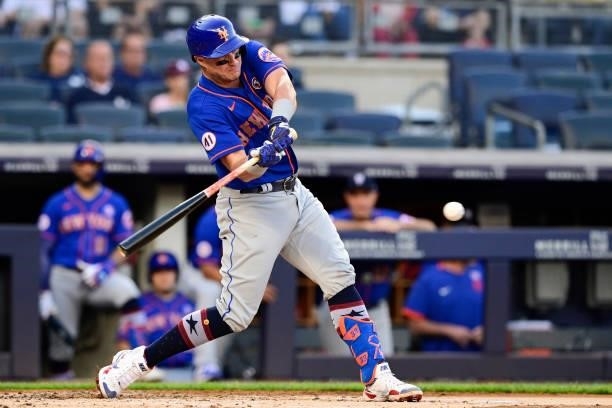 James McCann of the New York Mets hits a single against the New York Yankees during game two of a doubleheader at Yankee Stadium on July 04, 2021 in...