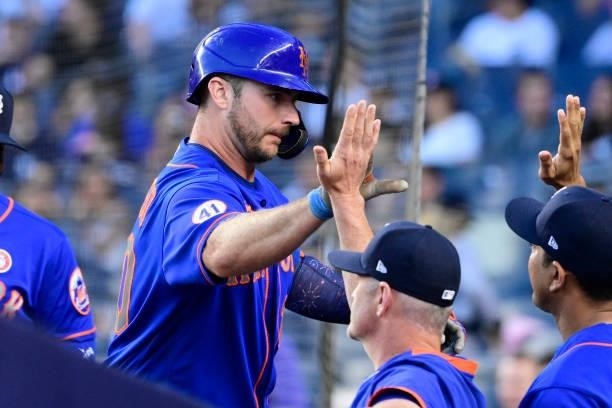 Pete Alonso of the New York Mets is congratulated by teammates after hitting a two run home run against the New York Yankees in the fourth inning...