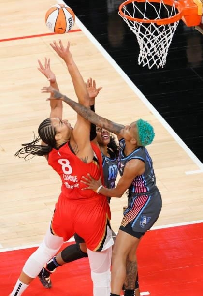 Liz Cambage of the Las Vegas Aces shoots against Cheyenne Parker and Courtney Williams of the Atlanta Dream during their game at Michelob ULTRA Arena...