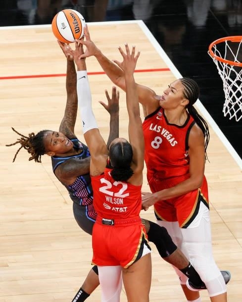 Ja Wilson and Liz Cambage of the Las Vegas Aces both block a shot by Crystal Bradford of the Atlanta Dream during their game at Michelob ULTRA Arena...