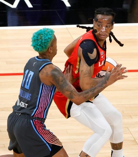 Riquna Williams of the Las Vegas Aces is guarded by Courtney Williams of the Atlanta Dream during their game at Michelob ULTRA Arena on July 4, 2021...