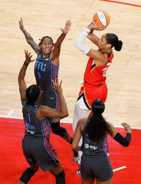 Ja Wilson of the Las Vegas Aces shoots against Crystal Bradford, Elizabeth Williams and Cheyenne Parker of the Atlanta Dream during their game at...