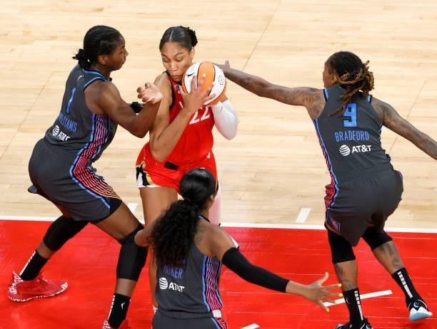 Ja Wilson of the Las Vegas Aces is defended by Elizabeth Williams, Crystal Bradford and Cheyenne Parker of the Atlanta Dream during their game at...