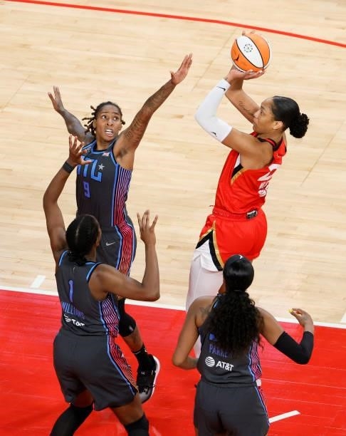 Ja Wilson of the Las Vegas Aces shoots against Crystal Bradford, Elizabeth Williams and Cheyenne Parker of the Atlanta Dream during their game at...
