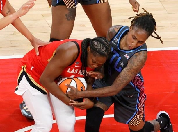 Chelsea Gray of the Las Vegas Aces grabs a rebound against Crystal Bradford of the Atlanta Dream during their game at Michelob ULTRA Arena on July 4,...
