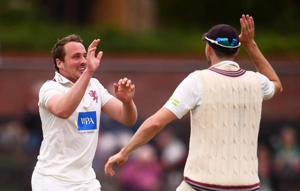 Josh Davey of Somerset celebrates after taking the wicket of Marcus Harris of Leicestershire with team mate Craig Overton during Day Two of the LV=...
