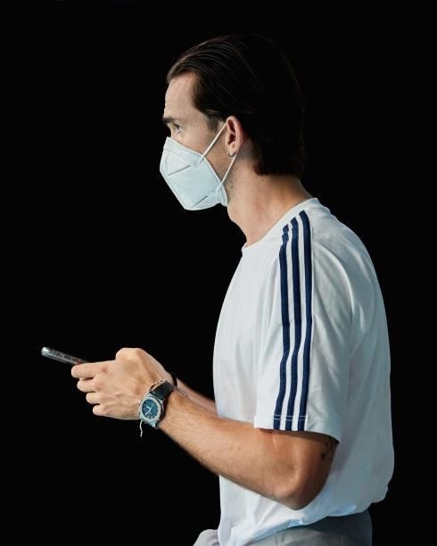 Fabian Ruiz of Spain checks his phone as he walks along the dressing room tunnel at Gazprom Arena stadium before the UEFA Euro 2020 Championship...