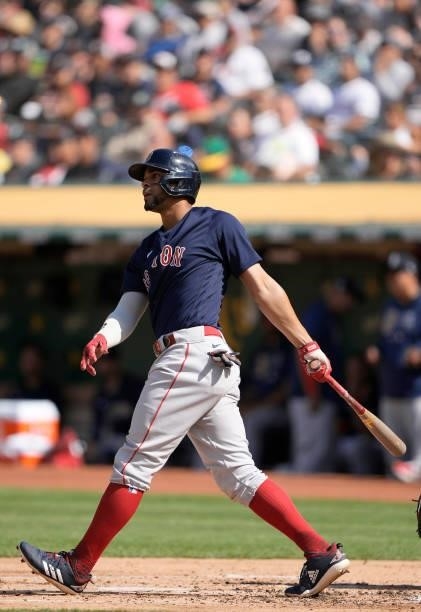 Xander Bogaerts of the Boston Red Sox hits a single against the Oakland Athletics in the top of the second inning at RingCentral Coliseum on July 03,...