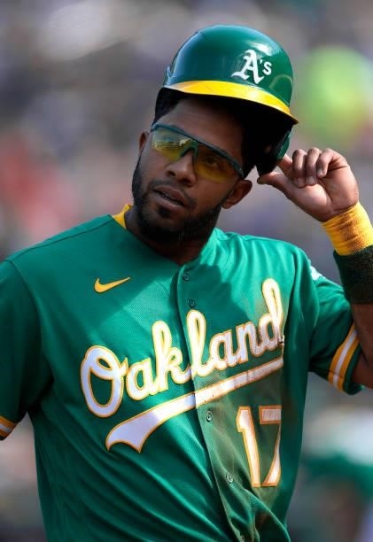 Elvis Andrus of the Oakland Athletics walks back to the dugout against the Boston Red Sox in the bottom of the first inning at RingCentral Coliseum...