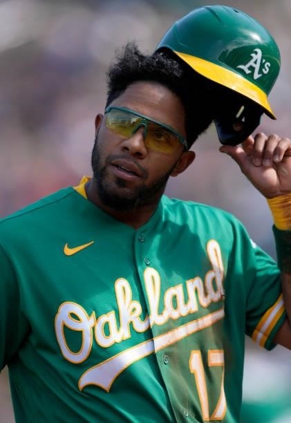 Elvis Andrus of the Oakland Athletics walks back to the dugout against the Boston Red Sox in the bottom of the first inning at RingCentral Coliseum...