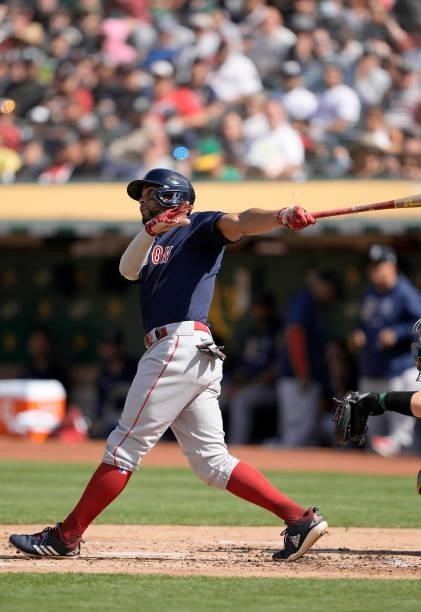 Xander Bogaerts of the Boston Red Sox hits a single against the Oakland Athletics in the top of the second inning at RingCentral Coliseum on July 03,...