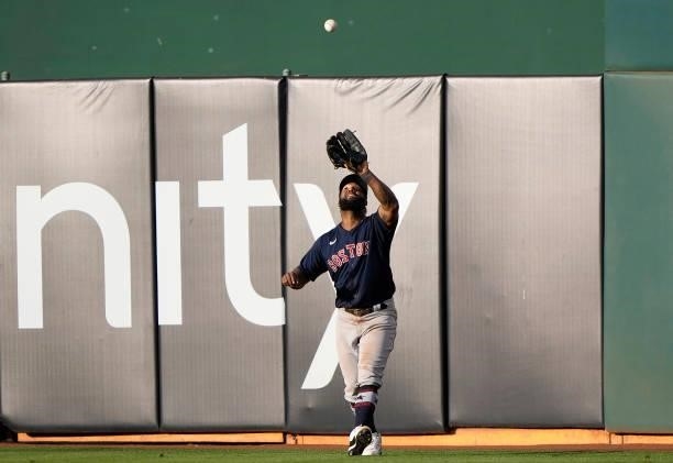Danny Santana of the Boston Red Sox catches a fly ball off the bat of Matt Olson of the Oakland Athletics in the bottom of the eighth inning at...