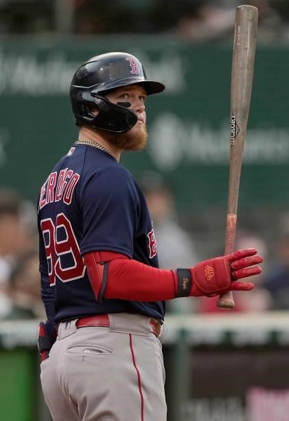 Alex Verdugo of the Boston Red Sox looks on from the on-deck circle against the Oakland Athletics in the top of the tenth inning at RingCentral...