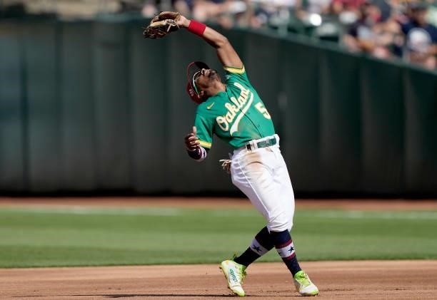 Tony Kemp of the Oakland Athletics catches a pop-up off the bat of Rafael Devers of the Boston Red Sox in the top of the second inning at RingCentral...