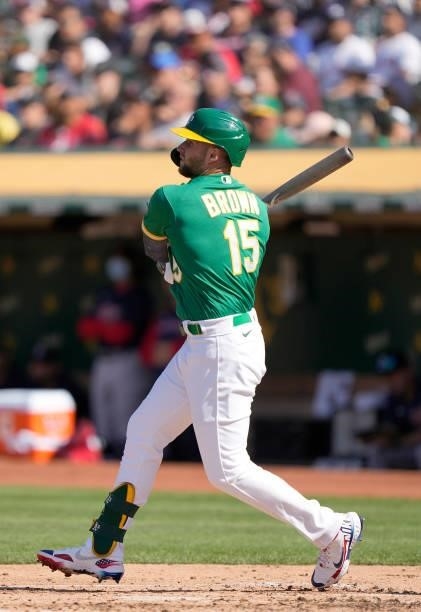 Seth Brown of the Oakland Athletics hits an RBI triple scoring Sean Murphy against the Boston Red Sox in the bottom of the second inning at...