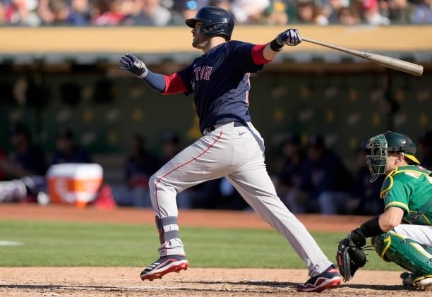 Martinez of the Boston Red Sox hits an RBI single scoring Enrique Hernandez against the Oakland Athletics in the top of the fifth inning at...