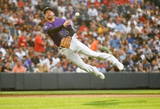 Ryan McMahon of the Colorado Rockies makes a throw to first base to attempt a force out in the second inning of a game against the St. Louis...