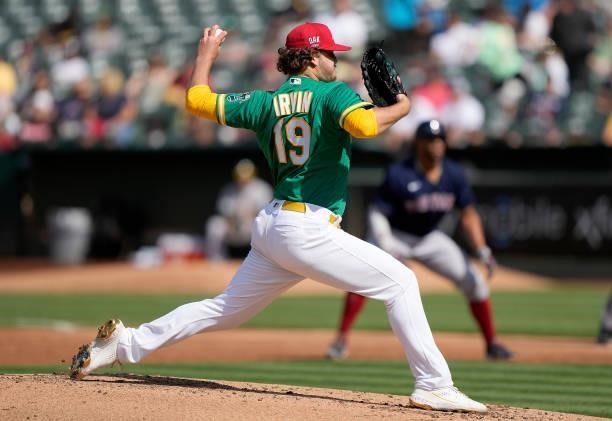 Cole Irvin of the Oakland Athletics pitches against the Boston Red Sox in the top of the second inning at RingCentral Coliseum on July 03, 2021 in...