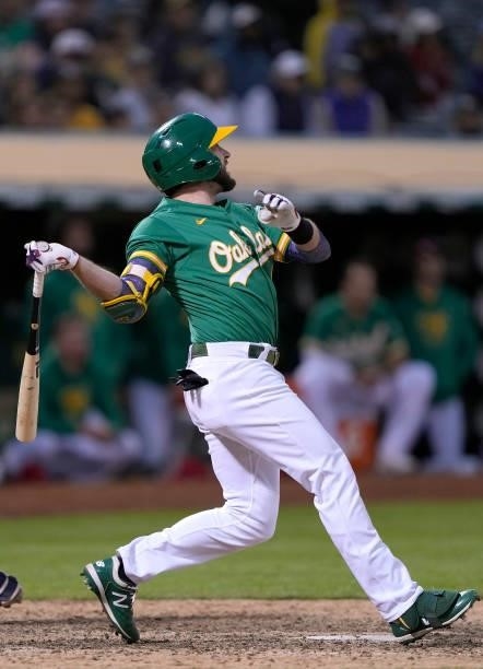 Jed Lowrie of the Oakland Athletics bats against the Boston Red Sox in the bottom of the 12th inning at RingCentral Coliseum on July 03, 2021 in...