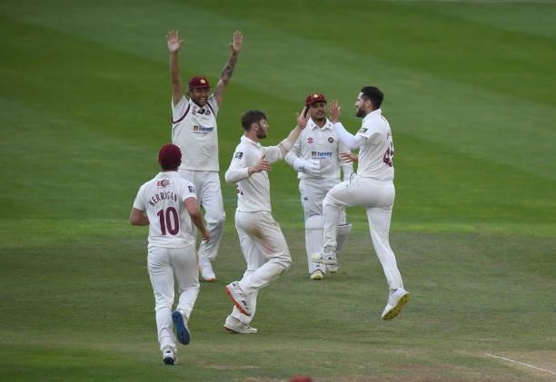 Wayne Parnell of Northamptonshire celebrates taking the wicket of Dom Bess of Yorkshire during the LV= Insurance County Championship match between...