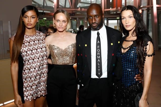 Joan Smalls, Amber Valletta, Virgil Abloh and Bella Hadid attend the Louis Vuitton Parfum Dinner at Fondation Louis Vuitton on July 05, 2021 in...