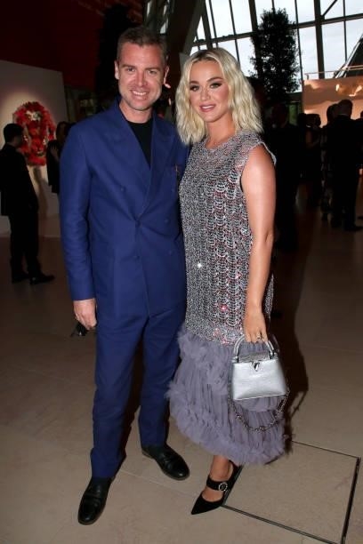Katy Perry and a guest attend Louis Vuitton Parfum hosts dinner at Fondation Louis Vuitton on July 05, 2021 in Paris, France.