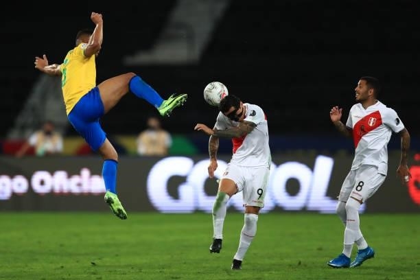 Casemiro of Brazil competes for the ball with Gianluca Lapadula of Peru during a semi-final match of Copa America Brazil 2021 between Brazil and Peru...