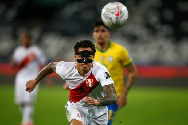 Gianluca Lapadula of Peru looks at the ball during a semi-final match of Copa America Brazil 2021 between Brazil and Peru at Estadio Olímpico Nilton...